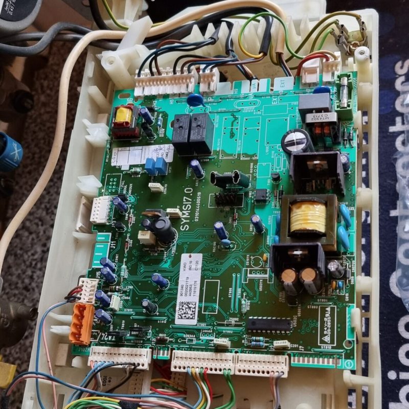 Broken boiler with PCB removed during emergency repair in Bletchley