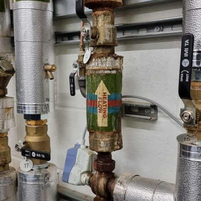 Emergency plumber fixing water damage from leaking system in Bletchley