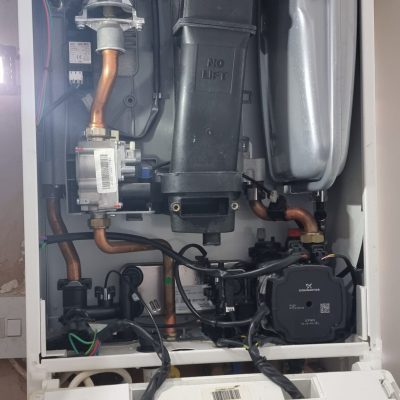 Broken boiler with PCB removed during emergency repair in Bletchley