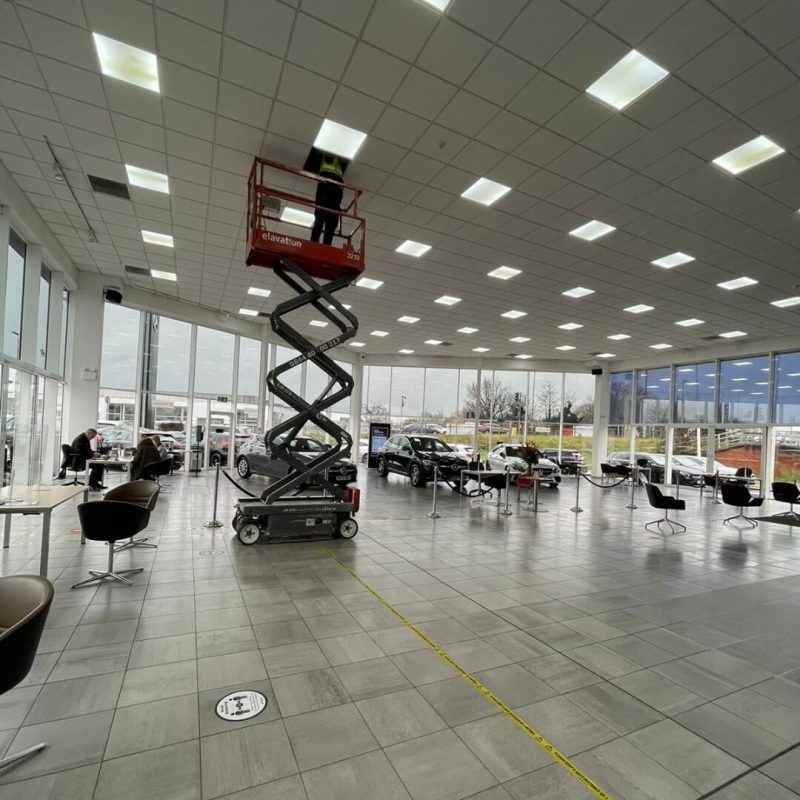 Professional electrician working on commercial unit in Bletchley