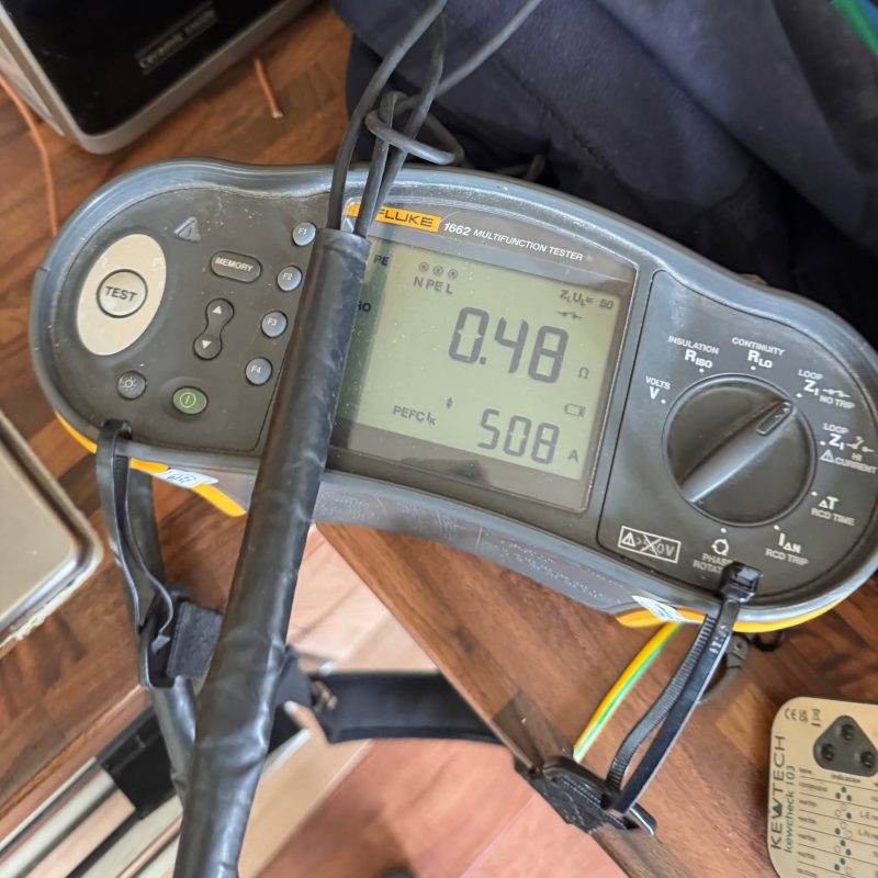 Emergency electrician performing electrical safety check in Bletchley